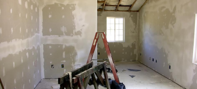 room with sheetrock and mud