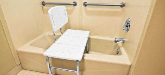 bathtub/shower combo with bath bench aid installed