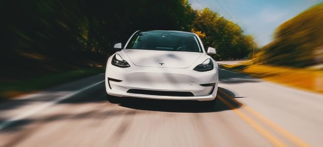 tesla model three electric car driving