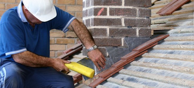 a person repairing a chimney