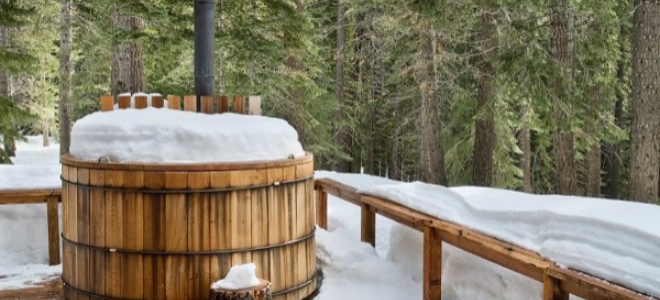 cedar hot tub on a deck in the snow