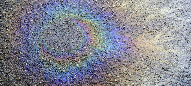 oil rainbow on asphalt driveway