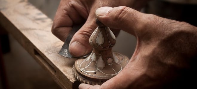 sanding an antique knob with inlay