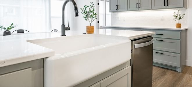 large, white farmhouse basin sink in kitchen