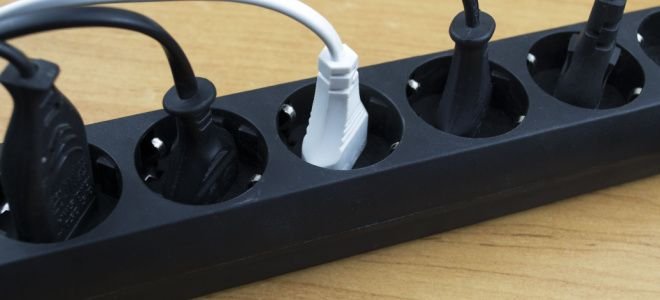 white and black cords in surge protector