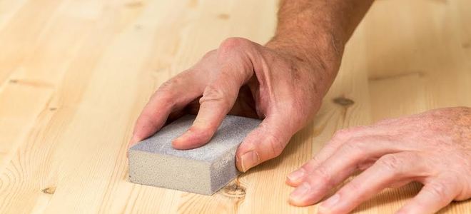 sanding a wood surface