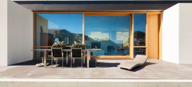 stylish concrete house with patio