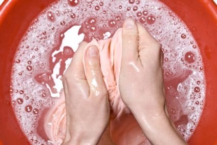 washing fabric in a large bowl