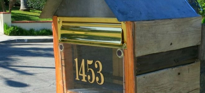 A mailbox made from reclaimed wood.