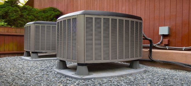 Two heat pumps outside a building