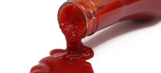 ketchup spilling out of a bottle