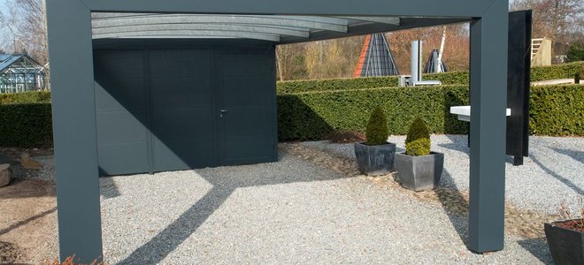 Carport with gravel parking space