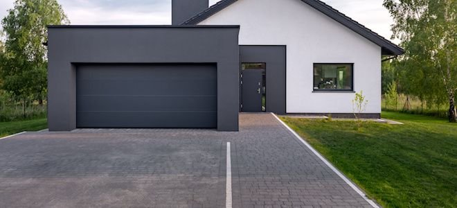 house with cobblestone driveway