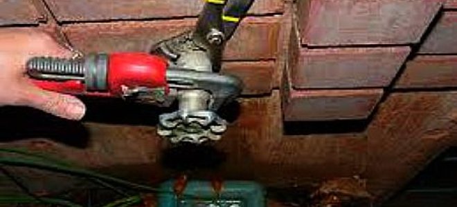 wrench on a water spigot