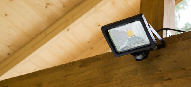 motion light mounted to wood beams