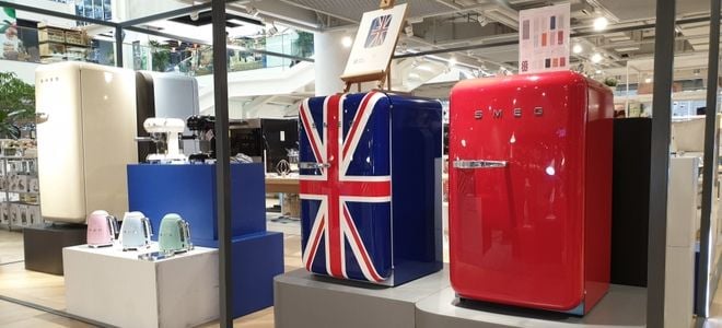 smeg refrigerator displays, one red, one with a Union Jack flag design