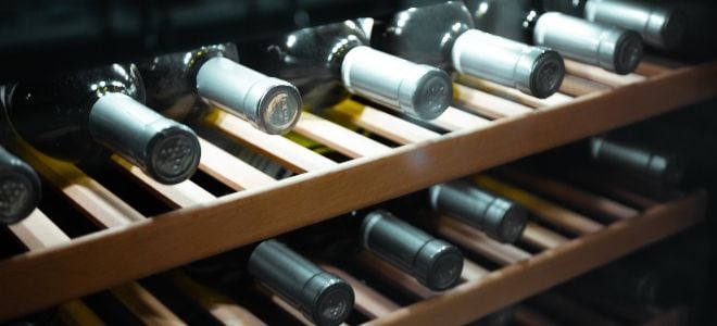 wine on wooden cooler racks