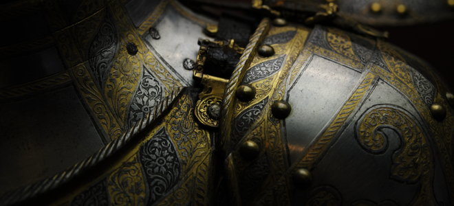 suit of medieval armor with gold decoration work