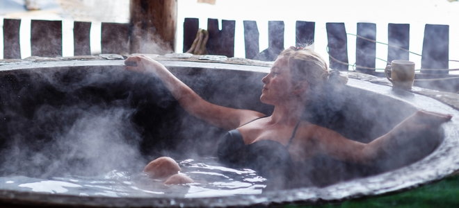 woman relaxing in a steamy hot tub