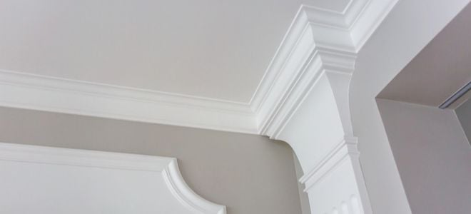 white classical molding on a gray wall
