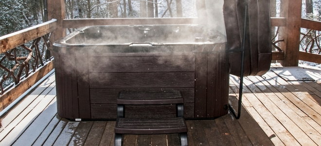 steaming hot tub in winter woods
