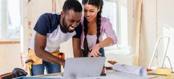 couple with laptop and tools