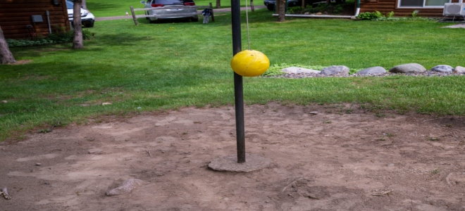 A backyard tetherball court. 