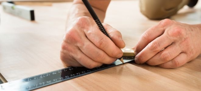 making a mark on a piece of flooring
