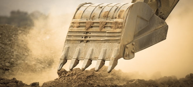tractor digging a scoop of dirt