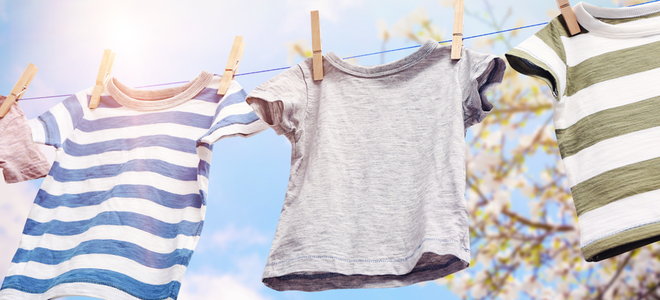 Tee shirts on a laundry line in the sun.