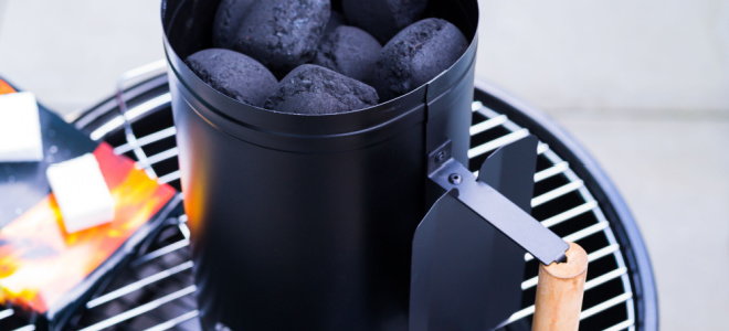 grill with coal fire starter on it