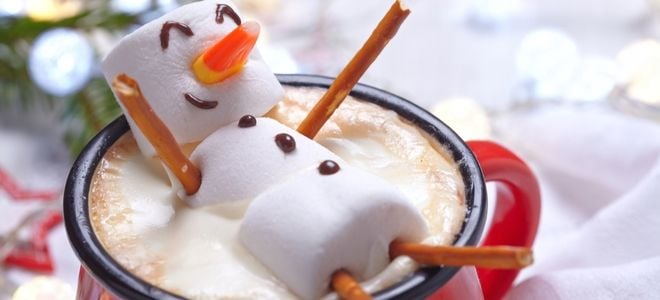 a marshmallow snowman in hot chocolate