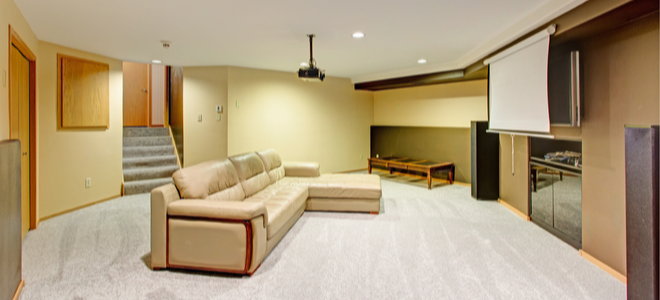 basement media room with projector screen