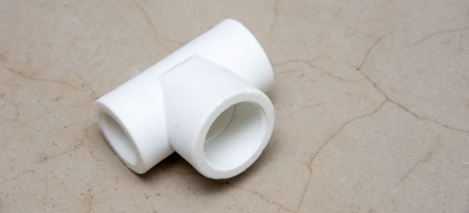 white T-shaped pipe fitting
