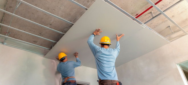 workers installing drywall ceiling