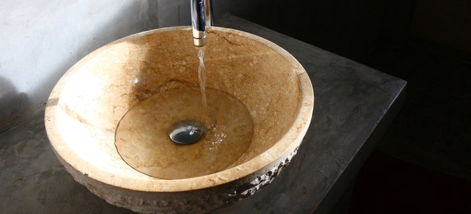 water running into a bowl sink