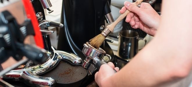 brushing out an espresso holder