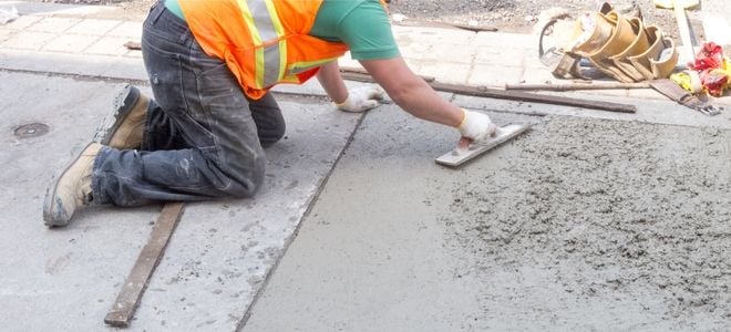 construction worker leveling concrete