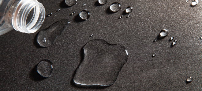 water on a black countertop