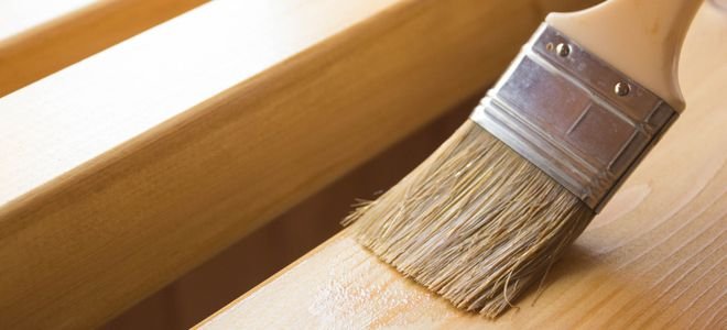 brushing a finish onto wood