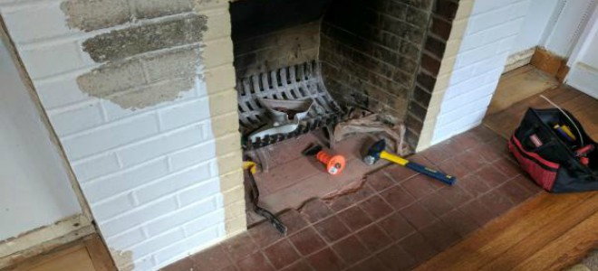 tools laying in front of a fireplace