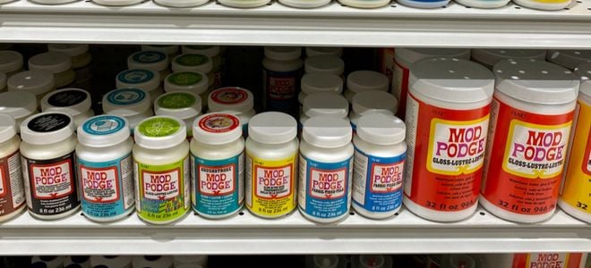 Mod Podge craft glues on a store shelf
