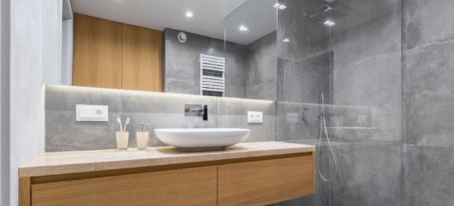 concrete walls in bathroom with mirrors