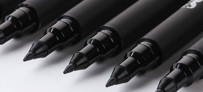 black felt tip pens with tops off