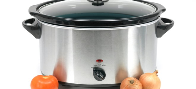 crock pot counter cooker with tomato and onions