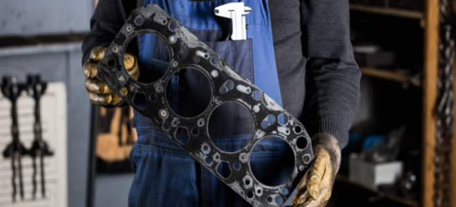 person holding head gasket