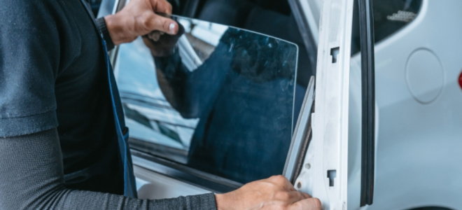 hands repairing car windows