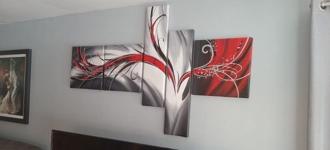 paintings hanging in multiple frames
