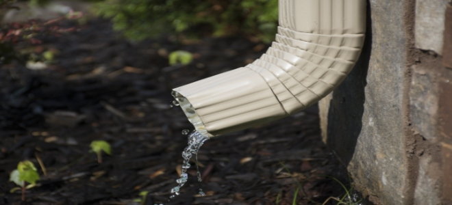 water running out of a gutter downspout