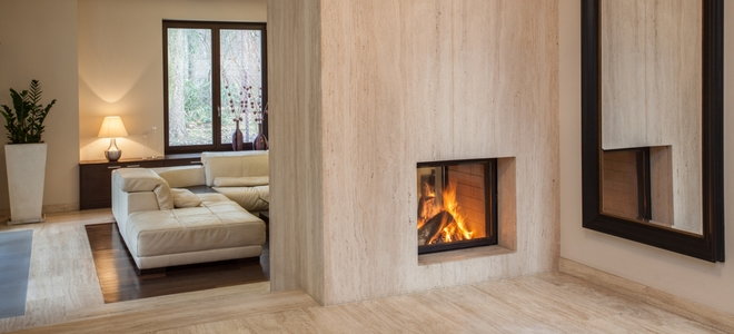 cozy space with wall mirror and fireplace